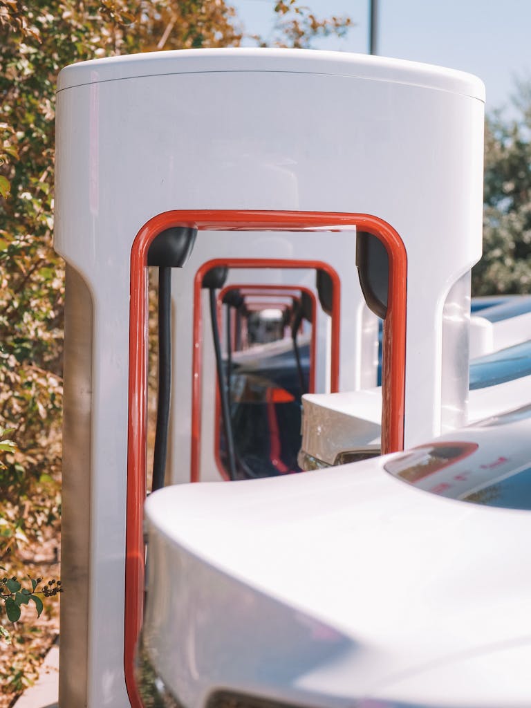 Electric cars charging at multiple stations with a modern design.